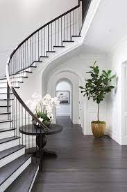 The 2d staircase collection for autocad 2004 and later versions. Chic Classic Foyer Features A Curved Staircase Wall Filled With A Black Round Table And Orchids Hamptons House House Design Staircase Design