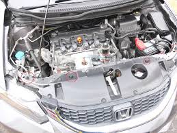 On the front of the latch assembly locate a circular mount with a spring around it. Honda Hood Stuck Won T Open Or Close