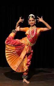 Cheerful young people throwing colorful powder in air, dancing at festival. Bharatanatyam Wikipedia