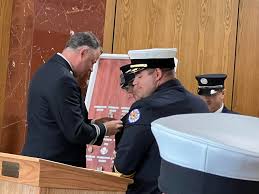 Please join us in...