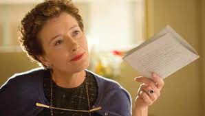 Travers sitting on a lounge chair by a pool at night in the movie saving mr. Emma Thompson On Saving Mr Banks And The Rarity Of Strong Female Leads