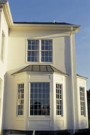 A lovely, spacious home with a wraparound porch and balcony on the second floor. Landscaping Ideas For The Fronts Of Bay Windows