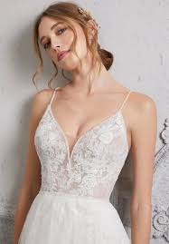 Classic and elegant, this soft net wedding dress features frosted, embroidered appliquès and a scalloped hemline. Peta Wedding Dress Morilee Uk