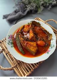 Sour and spicy) is a minangkabau and malay sour and spicy fish. Shutterstock Puzzlepix