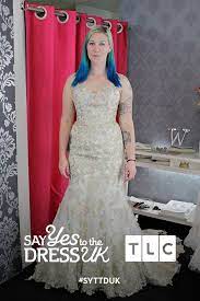 Layered skirt with drapery of white and soft pink taffeta and lace. Ditch The Trend A Gold Applique Dress With Stitched On Pastel Coloured Flowers Will Stand Out Among The Other White Gown Colorful Dresses Nice Dresses Dresses