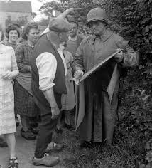 Major General John S Wood Commanding The 4th Armored Division And Civilians Holding A Map On The Road To Coutances D Day United States Army Division