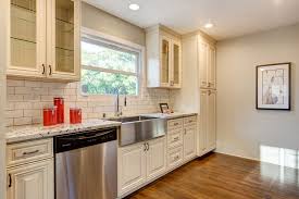How to select the right white countertops to install in your kitchen? Galley Kitchen Antique White Cabinets Glass Upper Cabinets Straight Edged White Antique White Kitchen Antique White Kitchen Cabinets Kitchen Cabinets