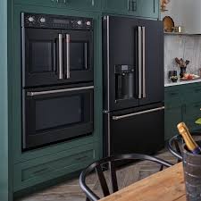 Green Kitchen Cabinets With Ge Cafe Matte Collection In Black With Brushed Stainless Steel Hardw Green Kitchen Cabinets Black Kitchen Cabinets Kitchen Interior