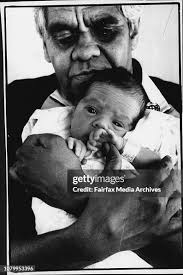 Sister Alison Bush holds young Harry Ramsay an aboriginal child.they...  News Photo