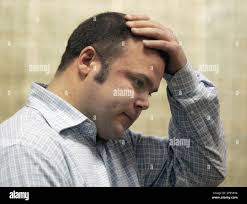 Ryan Ward of Toms River, N.J., reacts as he appears in Belmar Municipal  Court in Belmar, N.J.,