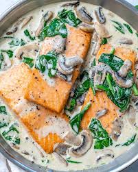 Combine spinach, salmon, asparagus, mushrooms, and carrot in a bowl; Easy Salmon Florentine Recipe Keto Friendly Healthy Fitness Meals