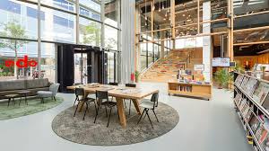 Aat Vos New Library Has An Inviting Character With A High Entrance And Natural Light Library Commercial Interiors Stairs Design