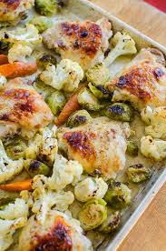 One Pan Chicken With Cauliflower Brussels Sprouts And Carrots Recipe Sheet Pan Recipes Chicken Brussel Sprouts Brussel Sprouts
