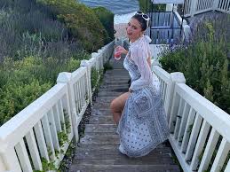 Kylie jenner proves the baggy jeans trend can be glam with a crop top and the funkiest denim heels kylie jenner is here to let us know that baggy jeans are the it look for summer. Kylie Jenner Wears Maxi Dress With Cutouts For A Beach Day