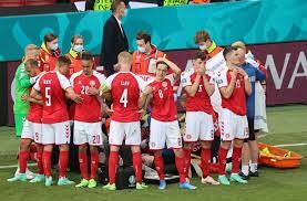 The denmark players crowded around eriksen after he collapsed on the pitchcredit: Z Hqyfum96s8vm