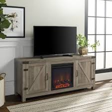 Birch Lane Tv Stand With Fireplace Trent Austin Design Adalberto Tv Stand For Tvs Up To 65 Inches Fireplace Tv Stand Barn Door Tv Stand Tv Decor