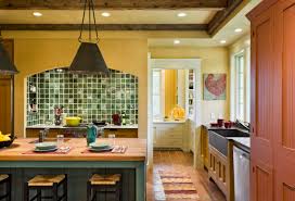yellow kitchen with wood countertops