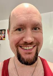 Can anyone extend my facial hair to the sides and make me have a full beard  please to the same length as how my facial hair is originally in this photo  please