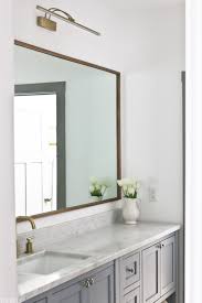 The arched shape paired with light wood on this diy mirror frame looks both soft and structural, and because this mirror is so easy to transport, it works perfectly whether you're doing your makeup or adding this to a gallery wall. Diy Wood Mirror Frame For Bathroom Vanity Tidbits