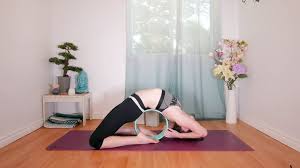 Use a folded blanket under the knees or shins for more comfort. 6 Ways To Improve Your Backbends Using A Yoga Wheel Yoga With Kassandra Blog