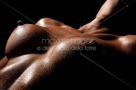 Photo of Art nude closeup of a woman naked breast with wet skin | Stock  Image MXI31470