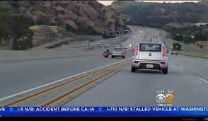 Watch Motorcyclist Kicks Car Causes Chain Reaction Crash On La Freeway