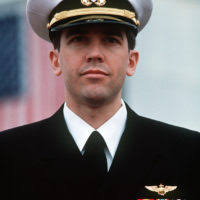 LT. Lawrence Slade, right, talks with three fellow officers following a  ceremony during which he and two other former prisoners of war (POWs) were  honored. Slade, LT. Jeffrey Zaun and LT. Robert