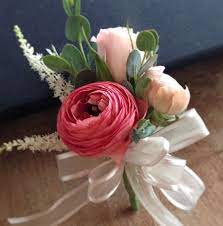 Pin On Corsage With Pink Ranunculus Spray Roses Astilbe Designed By Owens Flower Shop Lawrence Ks Bridal Shower Corsages Corsage Wedding Prom Flowers