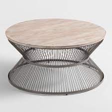 The table's base is sturdily crafted from metal, and features sweeping scrolled accents with an vintage flair. Round Wood And Metal Kearny Coffee Table V1 Round Wood Coffee Table Metal Coffee Table Coffee Table Wood