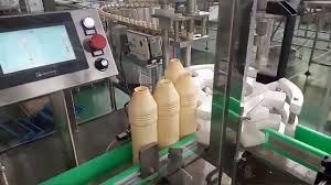 Edible Oil Filling Machine Weighing Filling Machine In 2020 Edible Oil Bottle Cleaner Packaging Machine