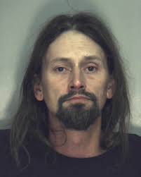 Husband charged with setting wife