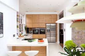 Www.imperfectinteriors.co.uk exposed brick walls with wall lights, black framed picture windows, grey. Kitchen Design Costs Build It