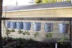 5 gallon bucket or pot organic potting mix organic fertilizer 1 tbsp epsom salt water determinate tomato seeds or plants mulch (optional) Grow Your Own Upside Down Tomato Planter The Garden