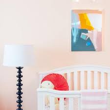 The glider features side pocket storage. Orange Nursery Glider On Blue Vintage Rug Contemporary Nursery