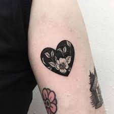 There is no denying that, but this is one of the most painful places to. Negative Space Heart Shaped Flower Tattoo Tattoogrid Net