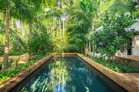 But even those away from the equator can get in on the fun with the right choice of plants and. Landscape Your Pool For A Lush Look Diy