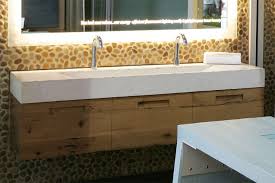 Most narrow bathroom sinks actually rotate the faucet so it runs parallel to the wall. Trough Sink For Two Faucets On Pebble Mosaic Wall Via Eko Us Com Trough Sink Bathroom Trough Sink Double Trough Sink