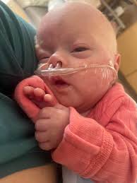 Look who took her very first bottle! This little thang. She's now 4.9  pounds to. She's just a cruising along. God truly is good. She's our little  miracle baby. Keep up the