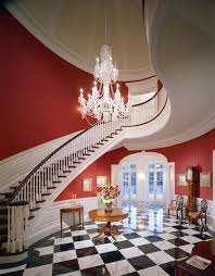 Our suggestions to design your stairs choosing this black and white marble is a beautiful natural stone. Jennifer Bevan La Foyer Design Traditional Staircase Red Walls