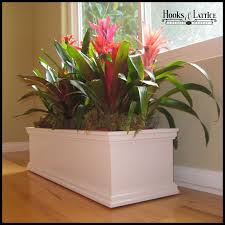 Window boxes filled with flowers add cheery color and brighten up windows, but an artificial flower arrangement might be best if the window box is hard to access or easy to forget. Indoor Window Box Google Search Garden Planter Boxes Artificial Flowers And Plants Planter Boxes