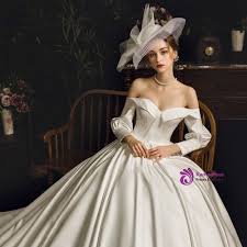 These wedding gown pictures show you the options in shape, cut and fabric. Simple White Ball Gown Satin Off The Shoulder Long Sleeve Wedding Dress White Ball Gowns Wedding Dress Long Sleeve Wedding Dresses