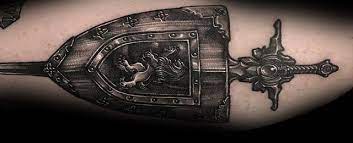 Shield tattoo can be a symbol of inner power and feeling of justice of its owner. Top 70 Best Shield Tattoo Design Ideas For Men Armor Body Art