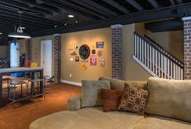 A Warm Comfortable Basement Family Room With An Industrial Flair With Rough Brick Exposed Ceil Exposed Basement Ceiling Basement Remodeling Basement Design