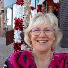 Photo of a young and older person with a dufflecoat