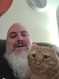 Is this white cat with a V-neck and white paws yours?