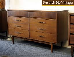 The simple design assures that it will blend well in any. Retro Double Dresser Gold Black Handles
