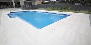 On a hot day, walking on a paved pool deck can feel like walking on the inside of an oven. Materia Marfil Spanish Porcelain Pavers Pavers Paverssydney Paving Pavingsydney Outdoortiles Outdoorpavers Outdoor Pool Patio Pool Deck Tile Pool Paving