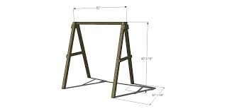 If desired, drill holes at an angle in the bottom of each leg and hammer a piece of rebar through the holes into the ground for added security. Free Diy Furniture Plans How To Build A Swing A Frame The Design Confidential
