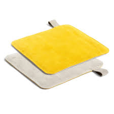 Oven gloves and pot holders make sure you won't burn your hands, nor drop dinner all over the kitchen floor. Hay Suede Potholder Connox