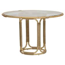 This patio wicker table is the perfect choice for your outdoor space. Pebble Coastal Beach Glass Top Woven Rattan Round Outdoor Dining Table 41 D 50 D Kathy Kuo Home